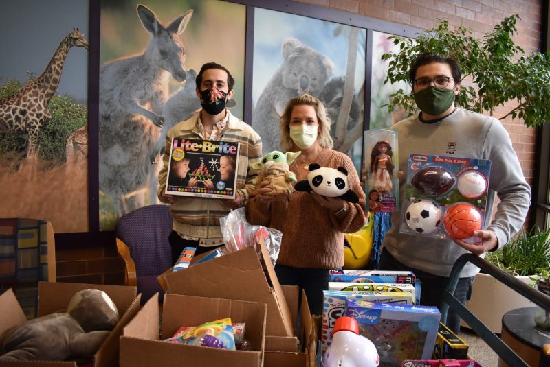 Josh Smith-Cohen, Shelly Hernandez, and John-Paul Paonessa deliver toys to Shriners Hospital Chicago.